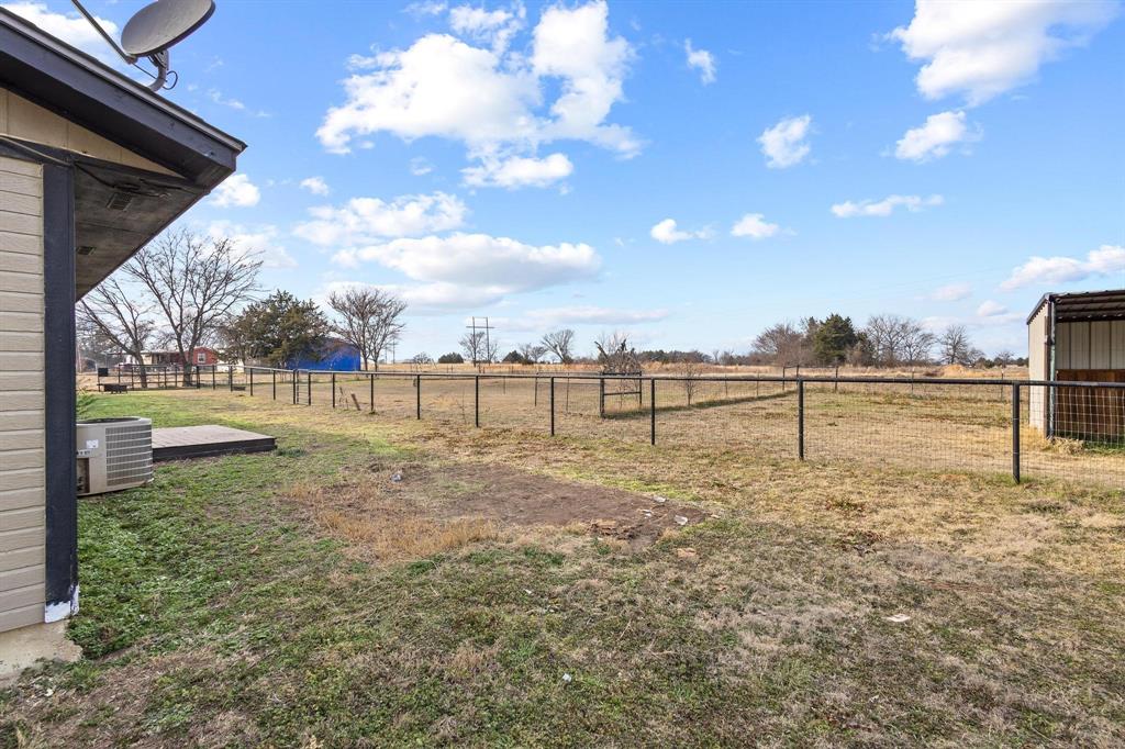 1223 Yowell Road Whitesboro, TX 76273 - Photo 21 of 30 a view of a yard with a slide