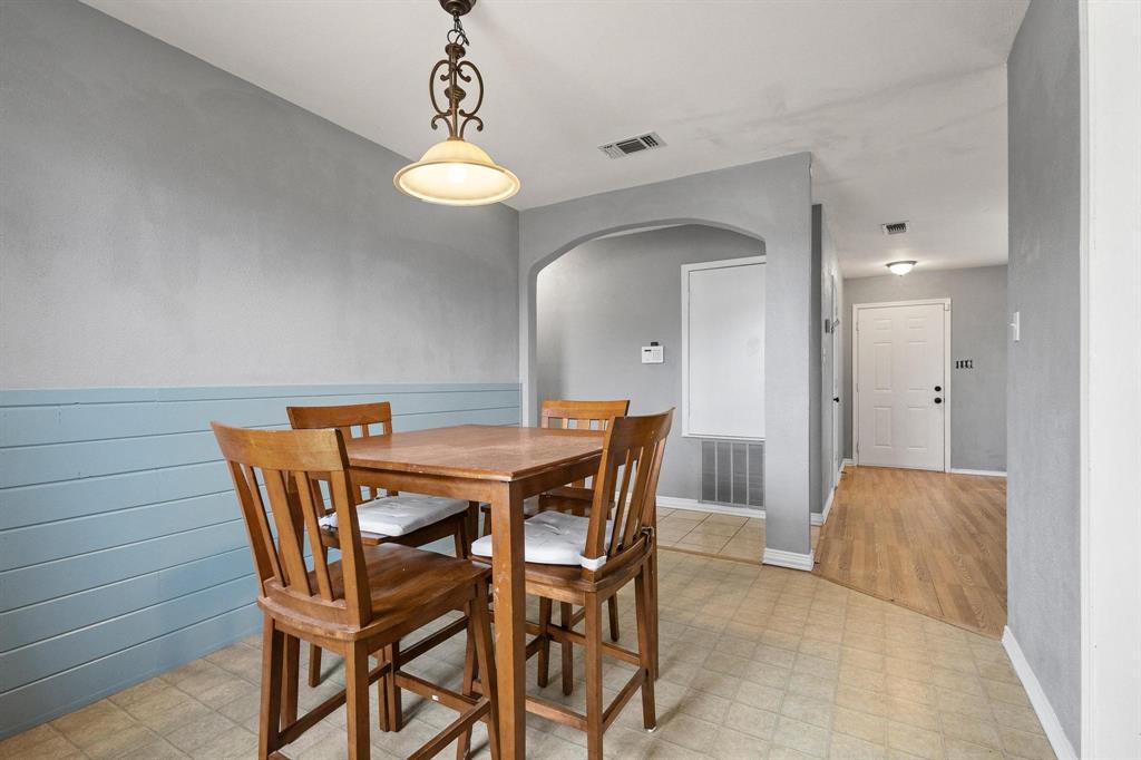 1223 Yowell Road Whitesboro, TX 76273 - Photo 8 of 30 a view of a dining room with furniture and chandelier