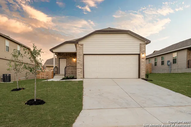 a view of a backyard of the house