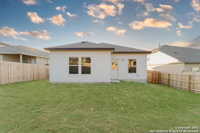 a view of a backyard of the house