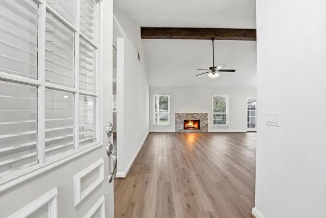 a view of a livingroom with furniture and hardwood floor