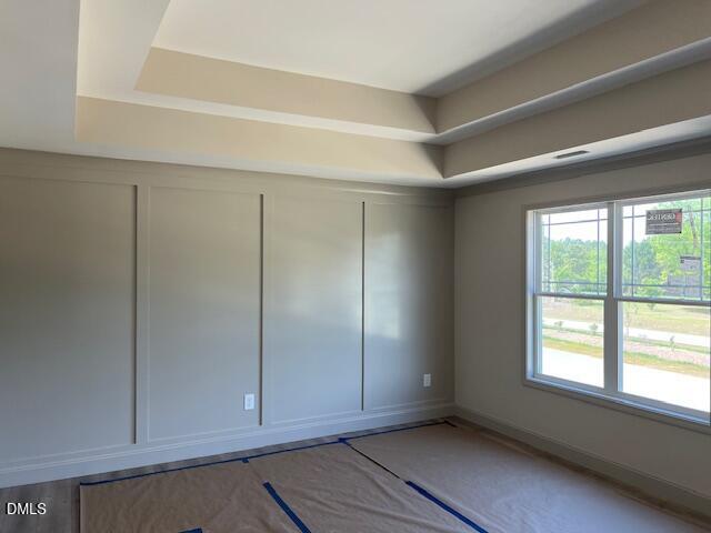 169 Big Pine Road Clayton, NC 27520 - Photo 7 of 14 a view of an empty room with window