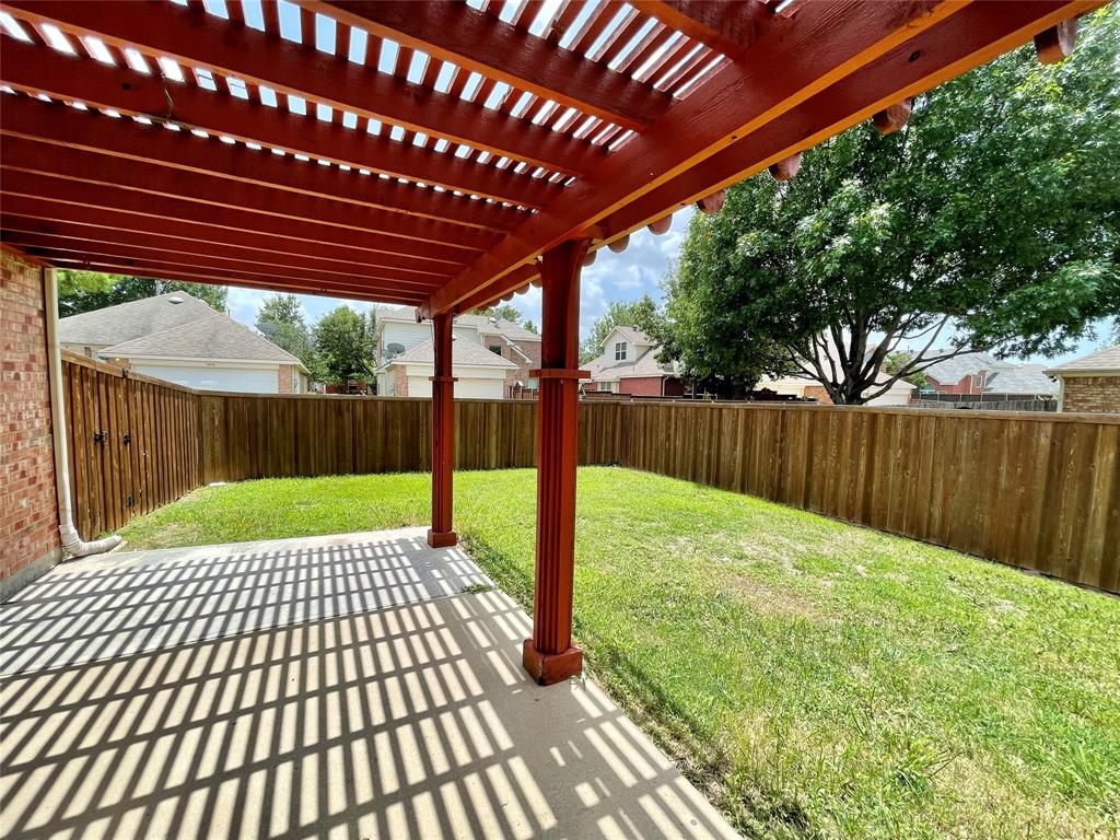 7205 Prairie Flower Lane Frisco, TX 75033 - Photo 21 of 23 a view of a backyard