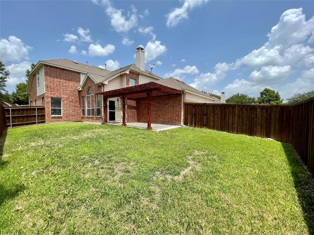 7205 Prairie Flower Lane Frisco, TX 75033 - Photo 23 of 23 a view of a house with a yard