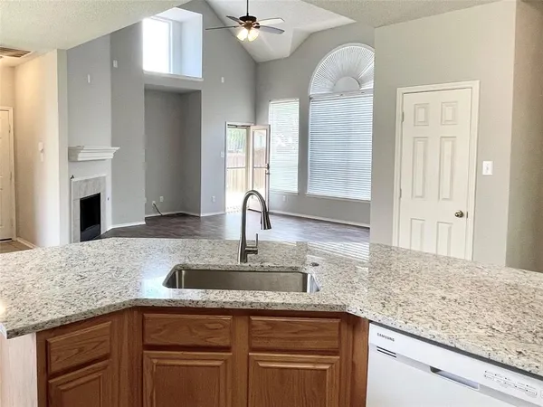 a kitchen with cabinets appliances and a counter space