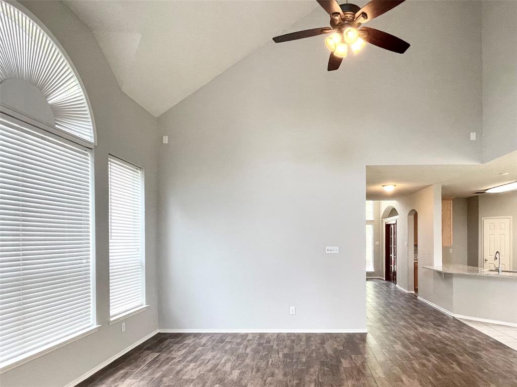 7205 Prairie Flower Lane Frisco, TX 75033 - Photo 10 of 23 wooden floor in an empty room with a window