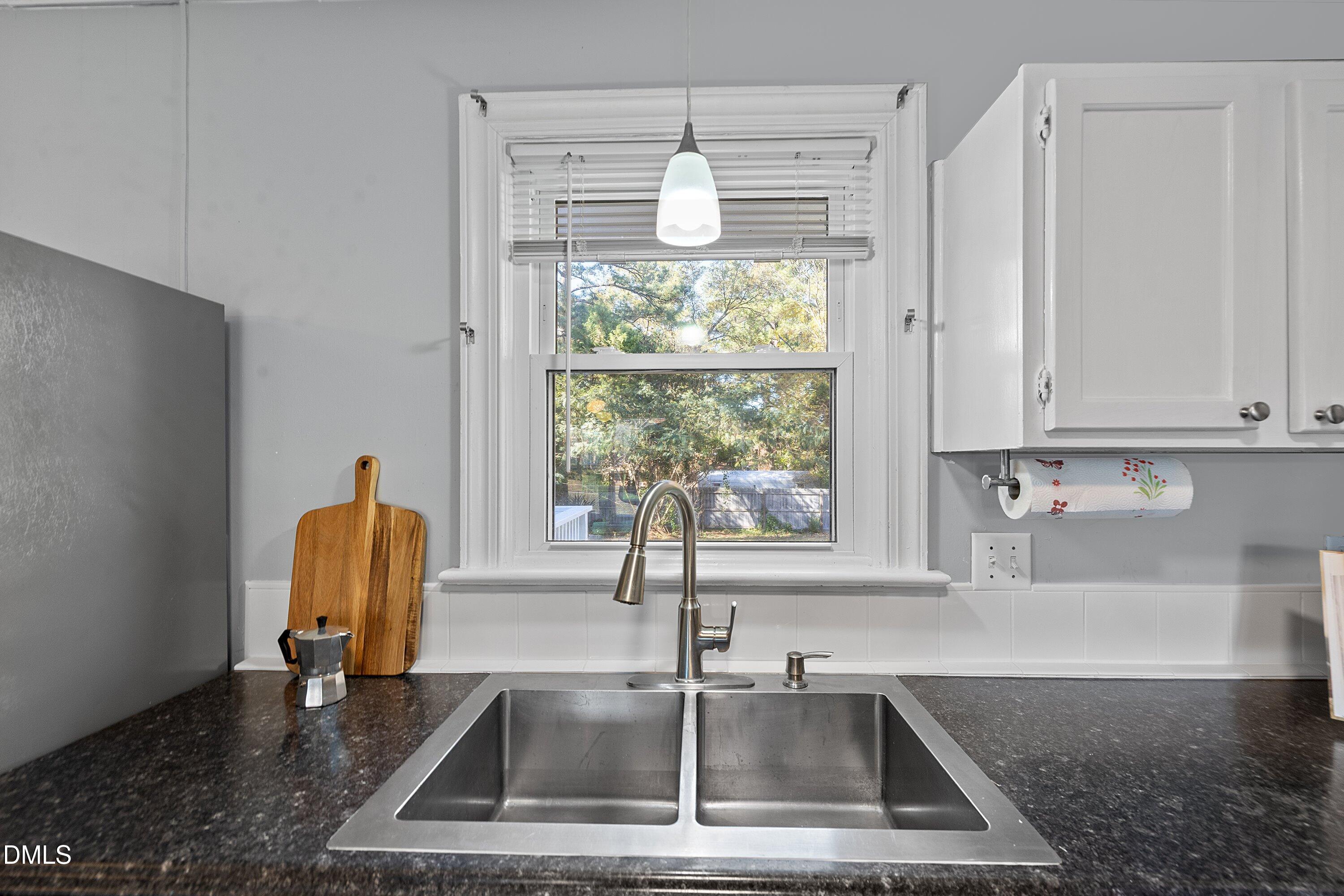506 West Branch Street Spring Hope, NC 27882 - Photo 19 of 42 a kitchen with a sink and a window
