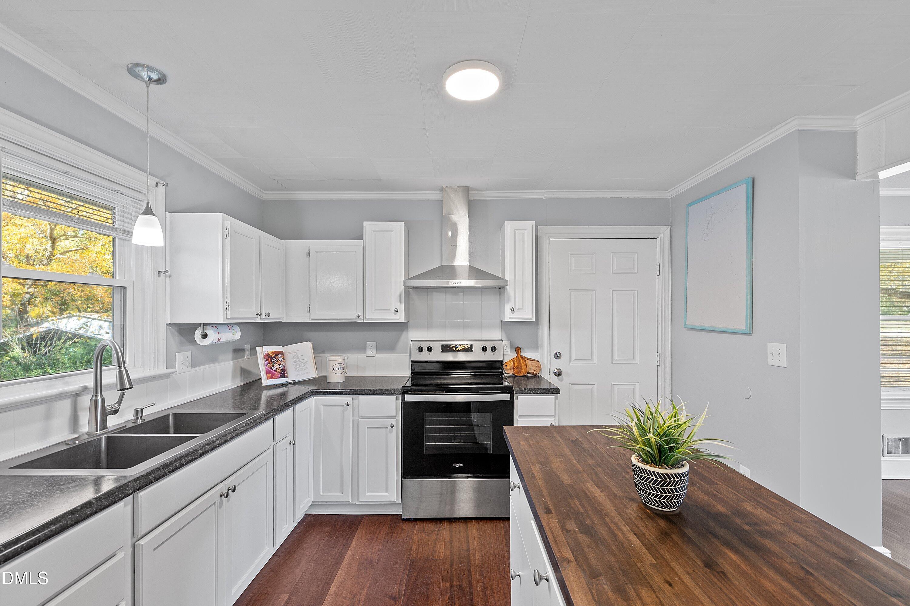 506 West Branch Street Spring Hope, NC 27882 - Photo 20 of 42 a kitchen with a sink stove and cabinets
