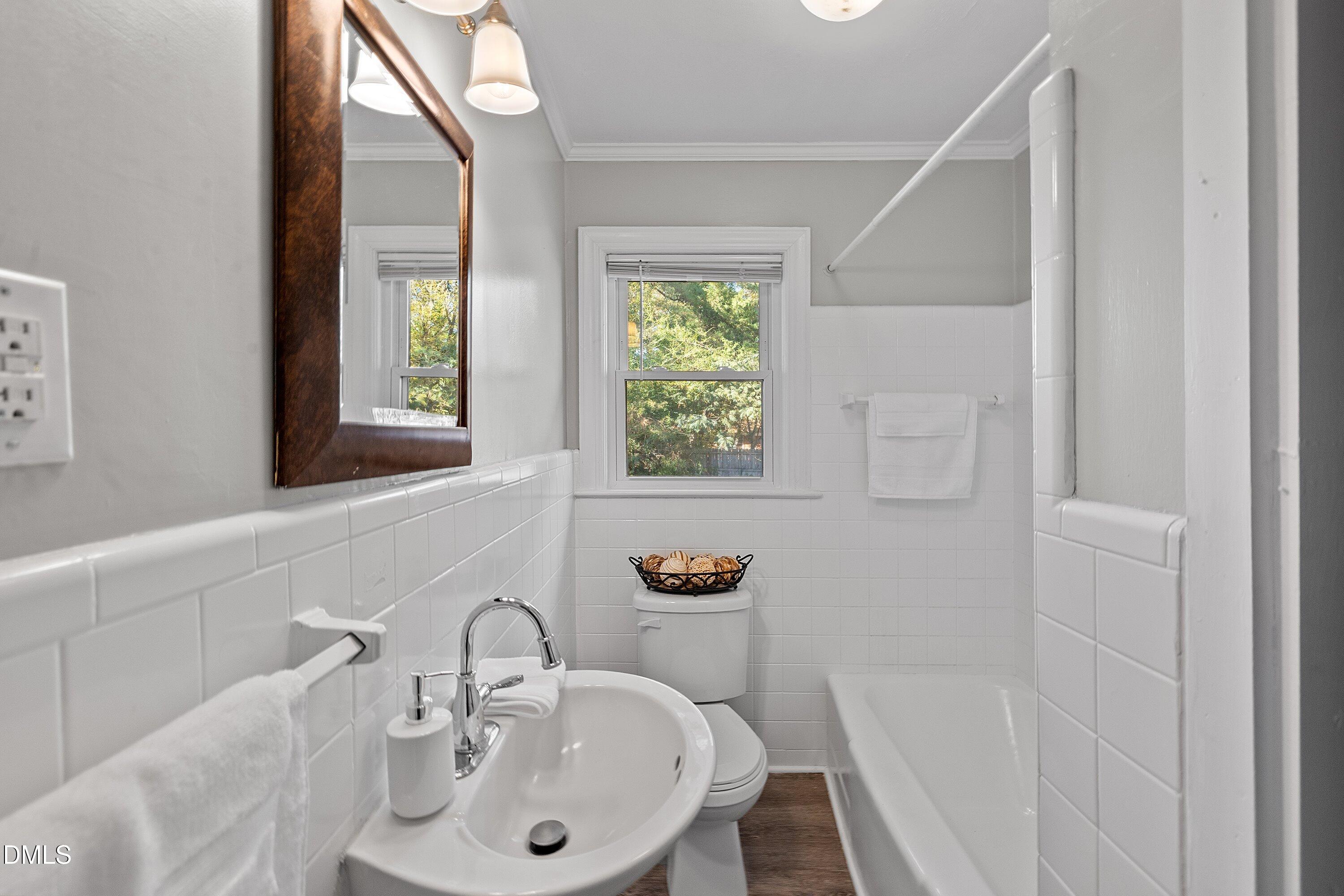 506 West Branch Street Spring Hope, NC 27882 - Photo 22 of 42 a bathroom with a sink and a mirror