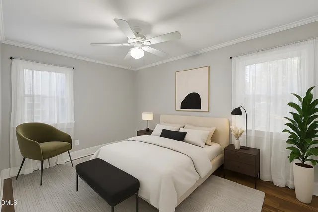 a bedroom with a large bed and a chair