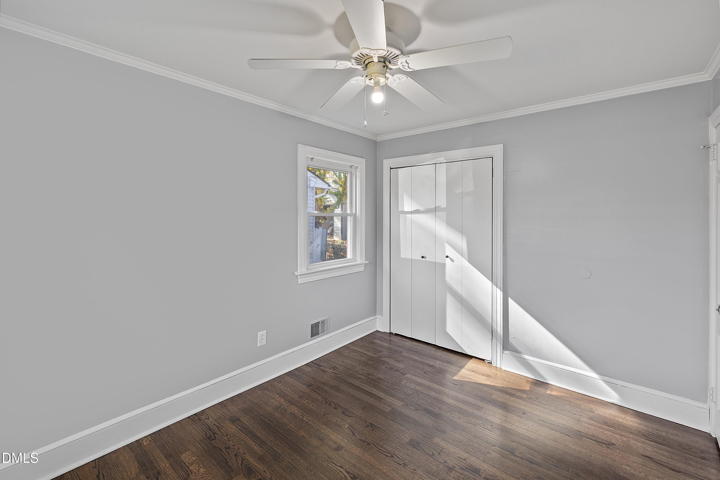 506 West Branch Street Spring Hope, NC 27882 - Photo 30 of 42 wooden floor in an empty room with a window