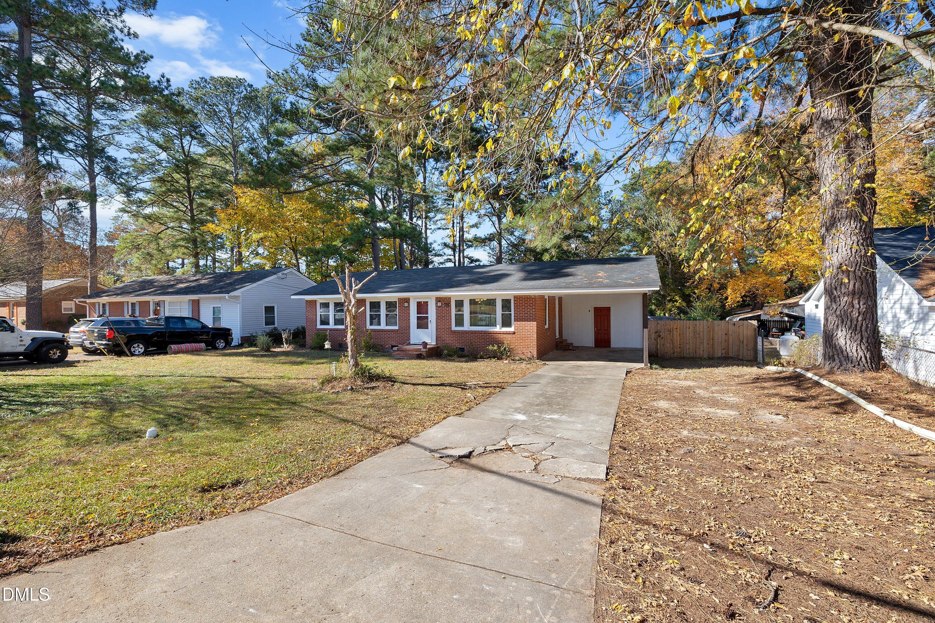 506 West Branch Street Spring Hope, NC 27882 - Photo 3 of 42 a front view of a house with a garden