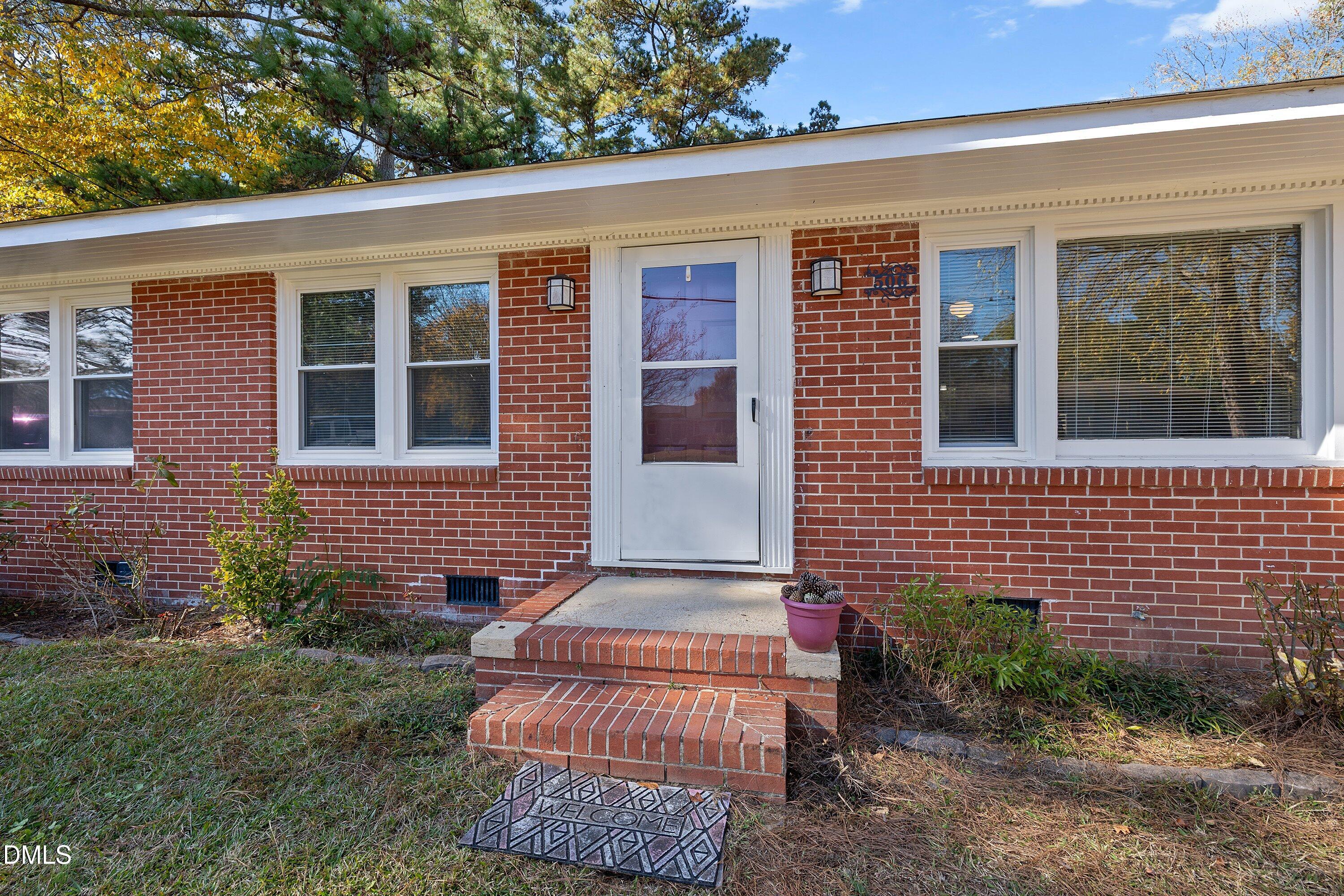 506 West Branch Street Spring Hope, NC 27882 - Photo 7 of 42 a front view of a house with a yard