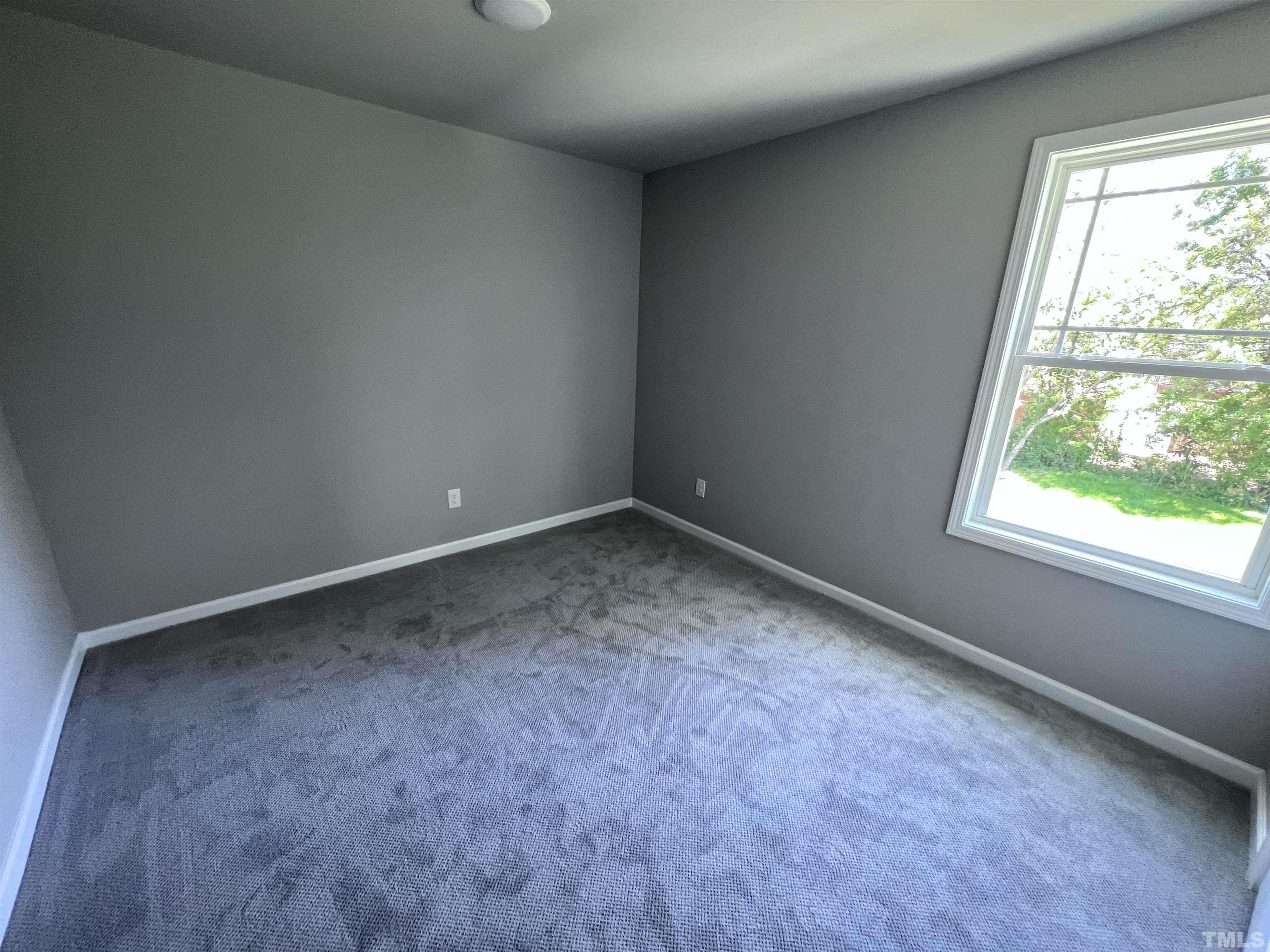 204 West Main Street Micro, NC 27576 - Photo 12 of 14 an empty room with a window