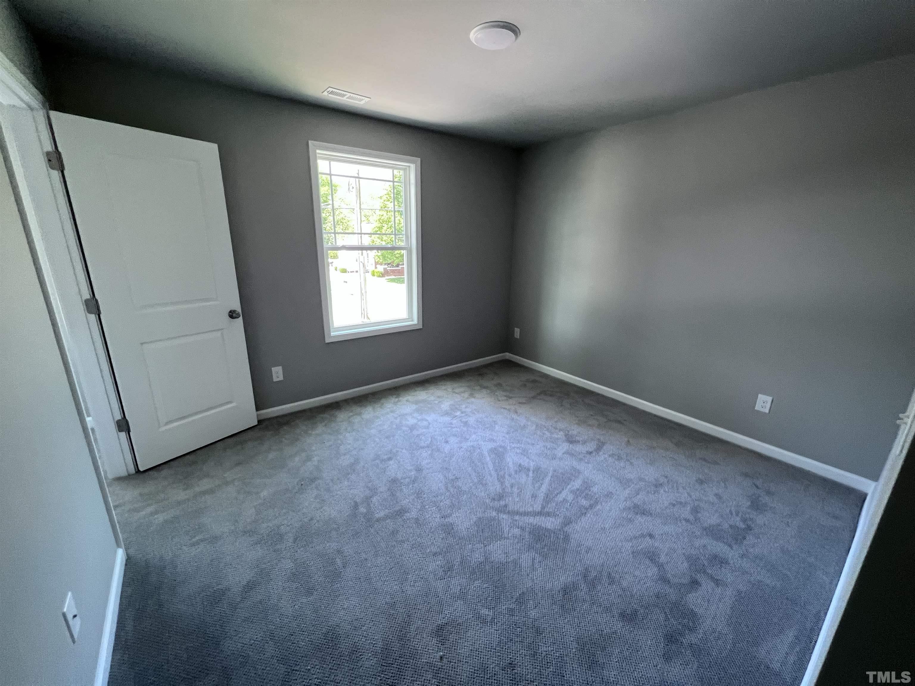204 West Main Street Micro, NC 27576 - Photo 13 of 14 an empty room with windows