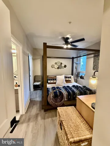 a bed sitting in a bedroom next to a window