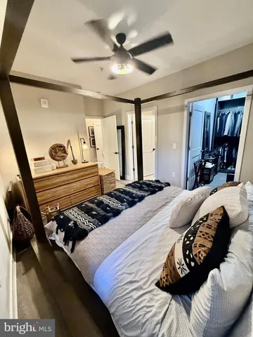 a bathroom with a double vanity sink toilet and mirror