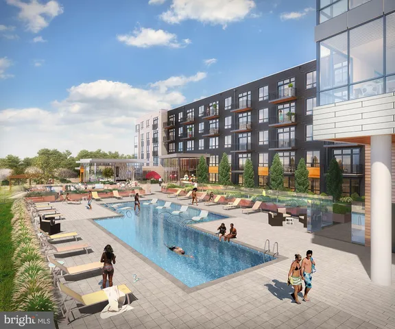 a view of a room with wooden floor and windows