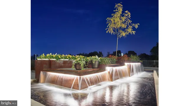a living room with furniture fireplace and windows