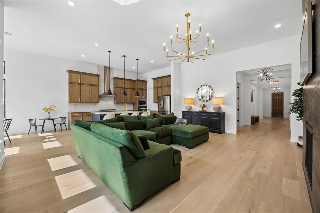 1717 Tolleson Drive Fort Worth, TX 76008 - Photo 6 of 40 a living room with furniture kitchen view and a chandelier