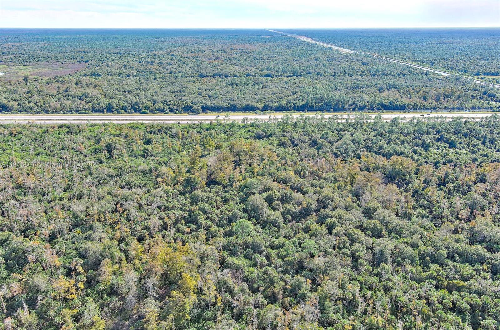 0 Alligator Alley Naples, FL 34117 - Photo 15 of 17 a view of an outdoor space with a lake view