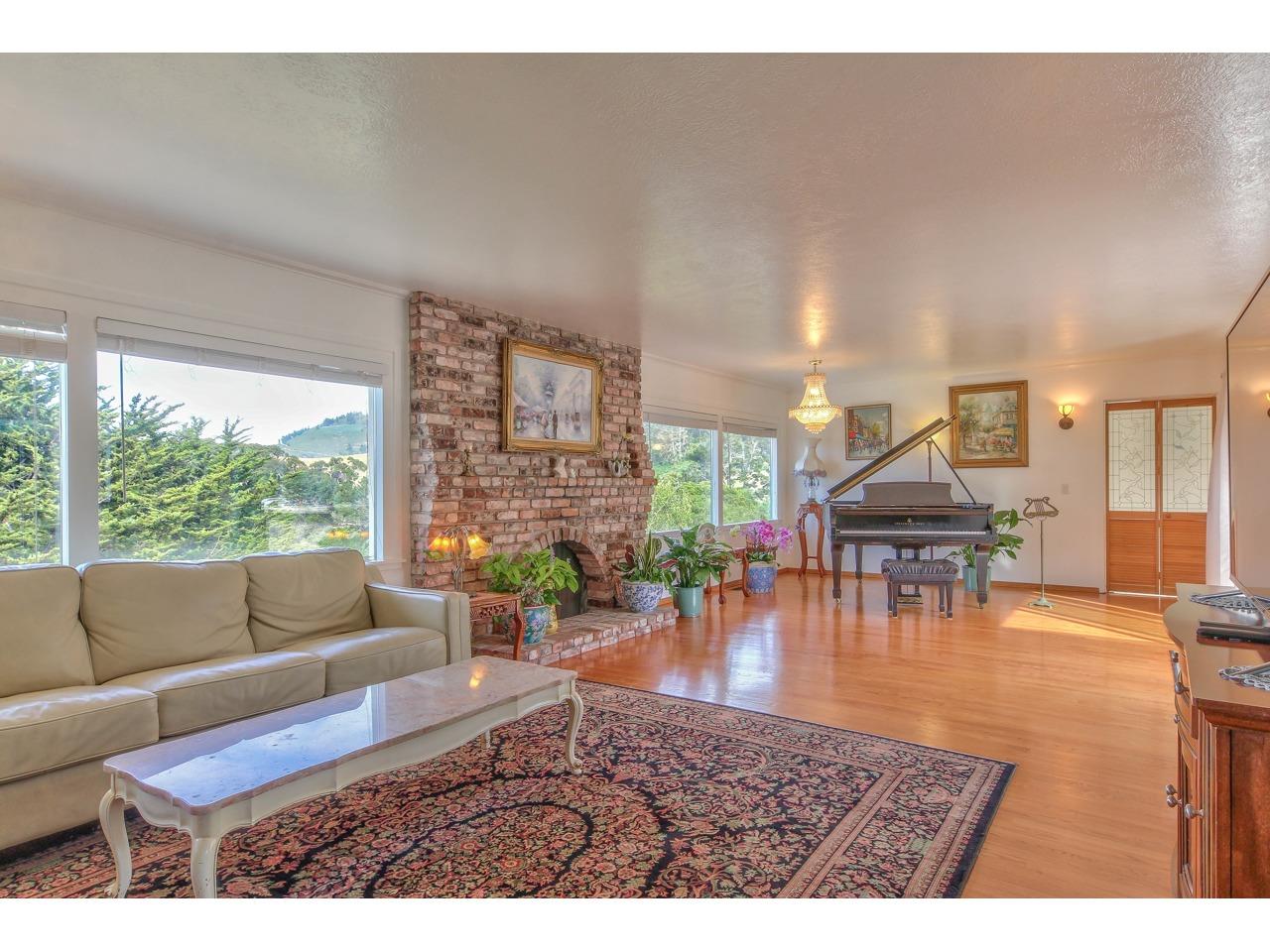 2985 Ribera Road Carmel, CA 93923 - Photo 17 of 33 a living room with furniture and a large window