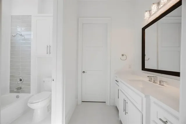 a bathroom with a toilet and a bathtub