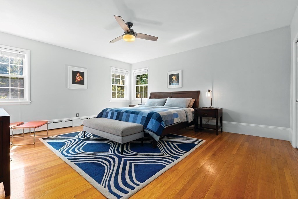 44 Rolling Lane Newton, MA 02467 - Photo 11 of 18 a bedroom with furniture and a wooden floor
