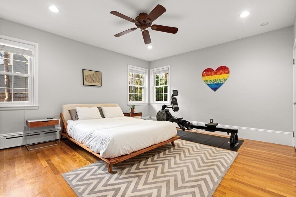 44 Rolling Lane Newton, MA 02467 - Photo 12 of 18 a bedroom with a bed and wooden floor