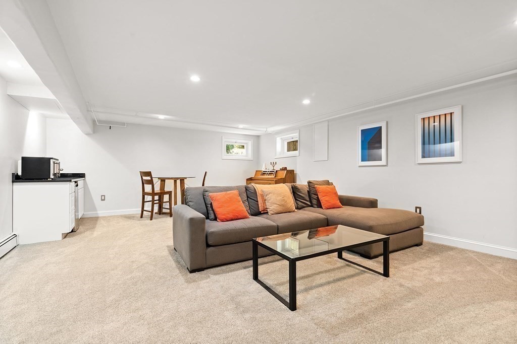 44 Rolling Lane Newton, MA 02467 - Photo 16 of 18 a living room with furniture and a lamp