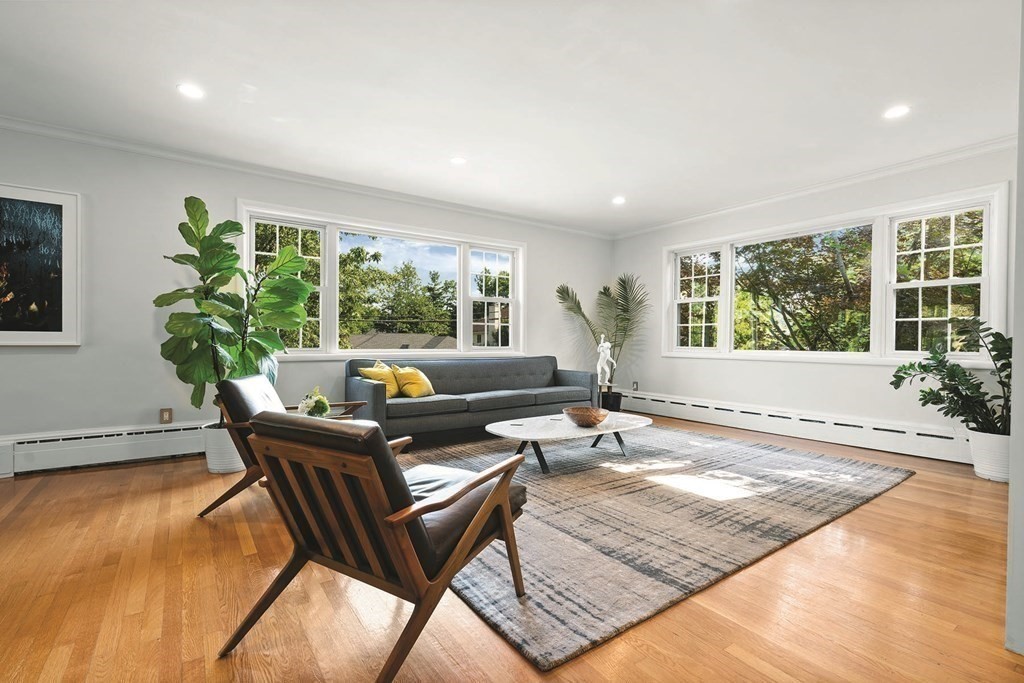44 Rolling Lane Newton, MA 02467 - Photo 5 of 18 a living room with patio furniture and a large window