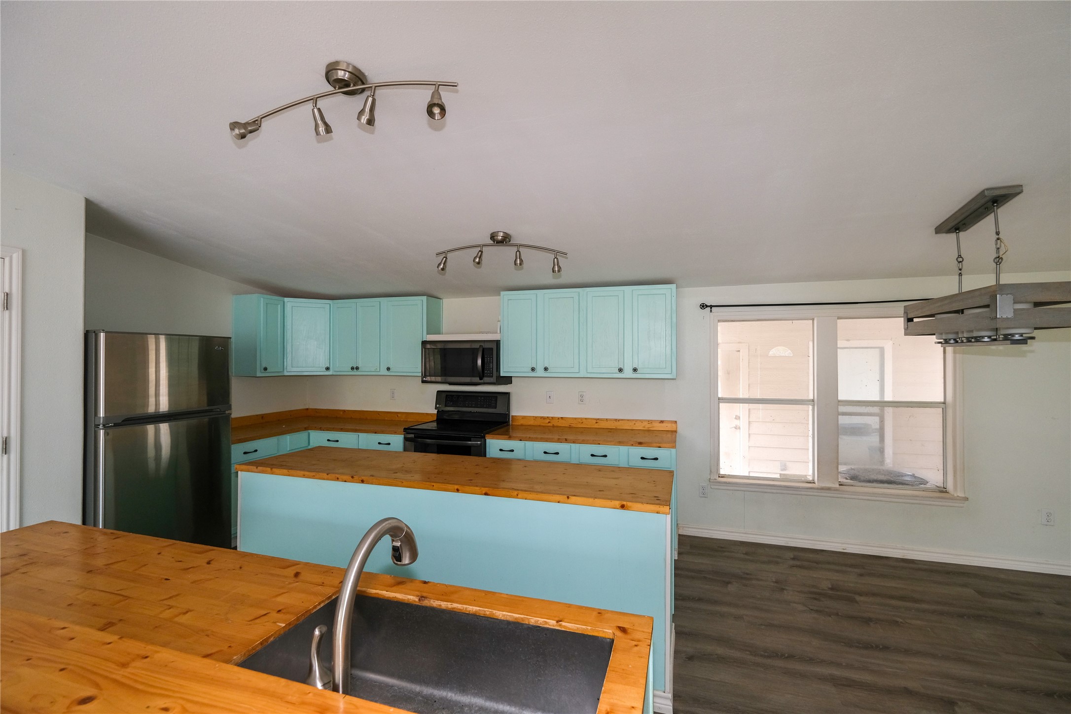 170 W Creek Trinity, TX 75862 - Photo 11 of 47 a view of a kitchen with a sink and dishwasher