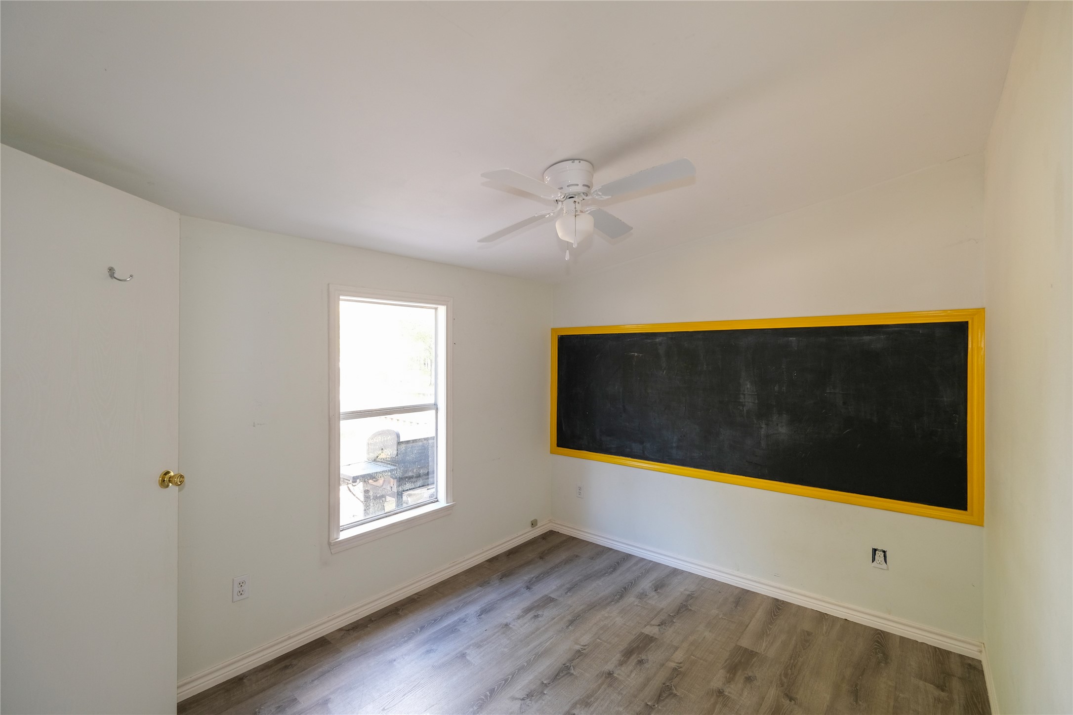 170 W Creek Trinity, TX 75862 - Photo 14 of 47 a view of an empty room with wooden floor and a window