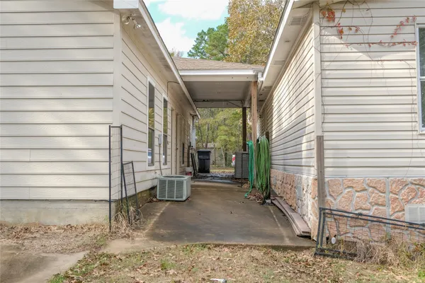 a view of a house with a yard and a garage