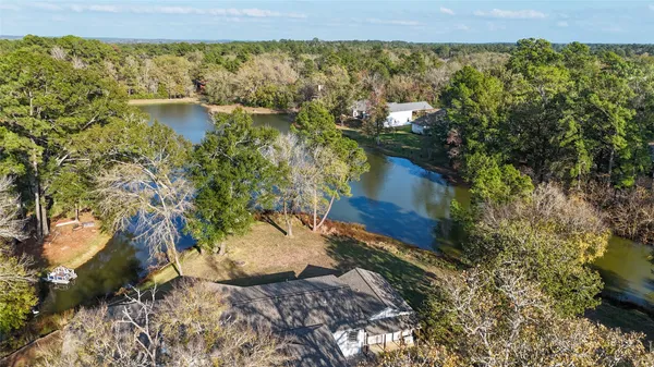 an aerial view of house with yard swimming pool and outdoor seating