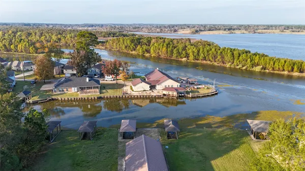 an aerial view of a house with garden space ocean view