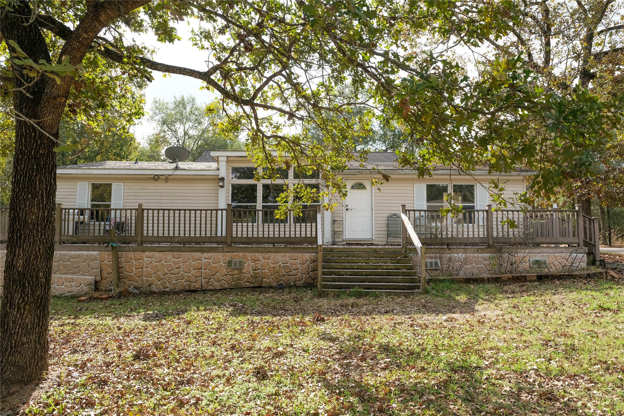 170 W Creek Trinity, TX 75862 - Photo 5 of 47 front view of a house with a bench