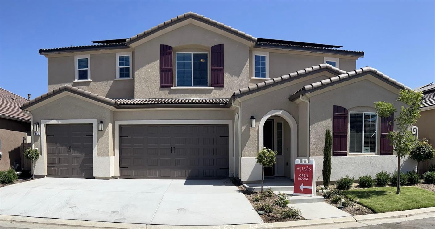 465 Bloom Lane Clovis, CA 93619 - Photo 1 of 16 a front view of a house with garden