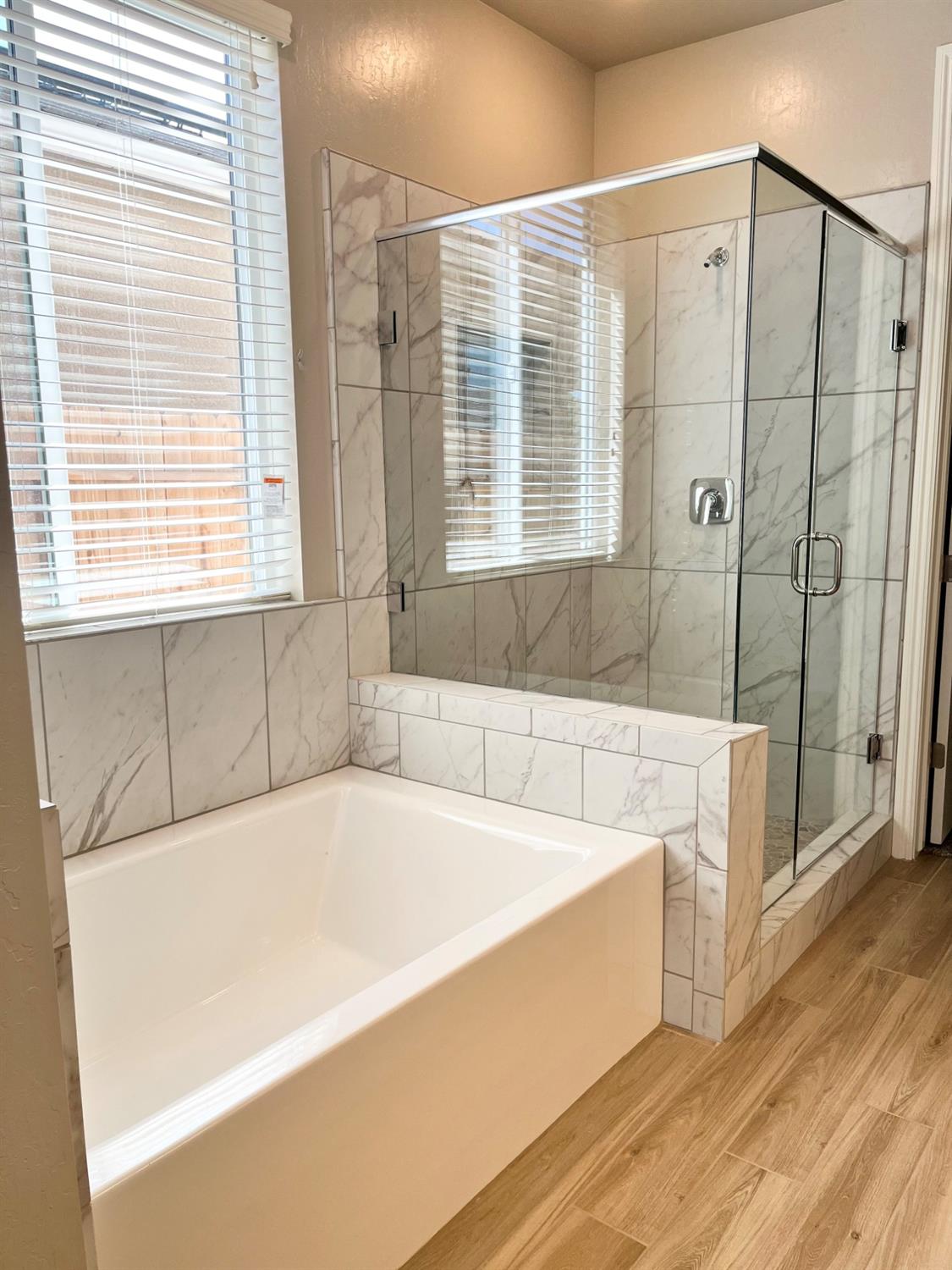 465 Bloom Lane Clovis, CA 93619 - Photo 12 of 16 a bathroom with bathtub and window