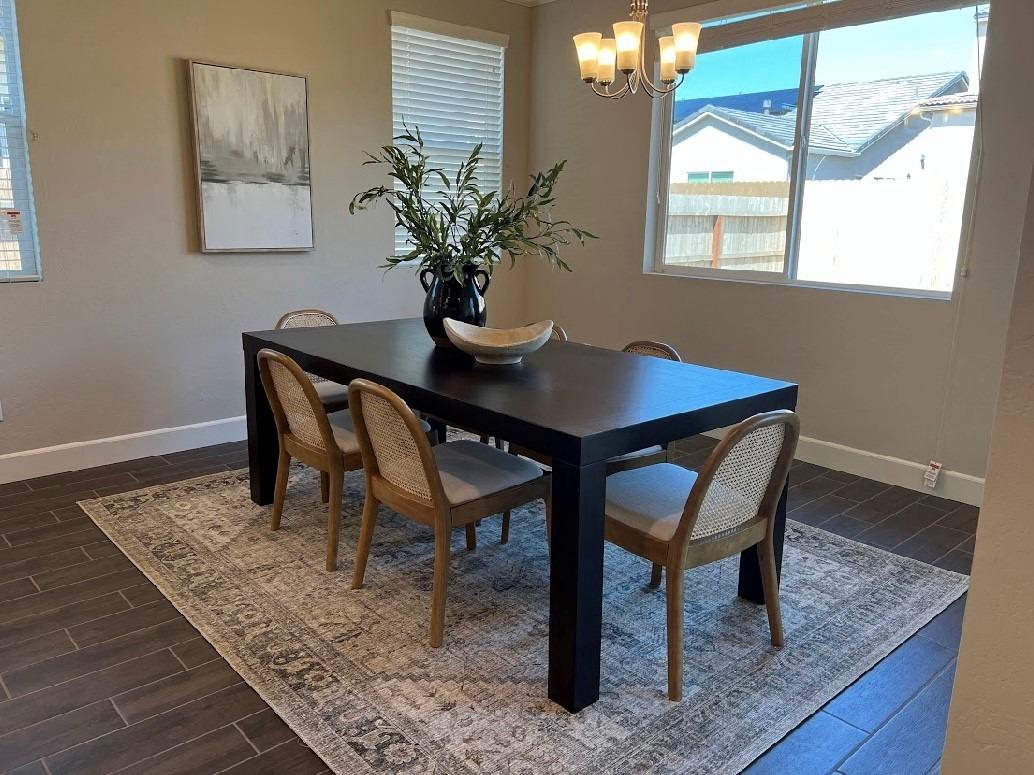 465 Bloom Lane Clovis, CA 93619 - Photo 4 of 16 a dining room with furniture and window