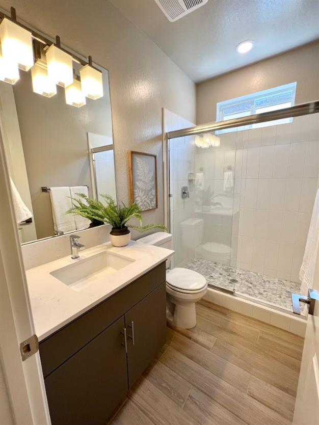 465 Bloom Lane Clovis, CA 93619 - Photo 7 of 16 a bathroom with a granite countertop sink toilet and shower