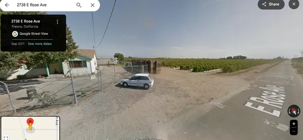 a view of a pathway with a yard
