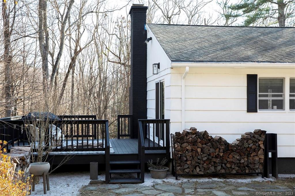 10 Sentry Hill Road Roxbury, CT 06783 - Photo 27 of 28 a view of a chair and table in the back yard of the house