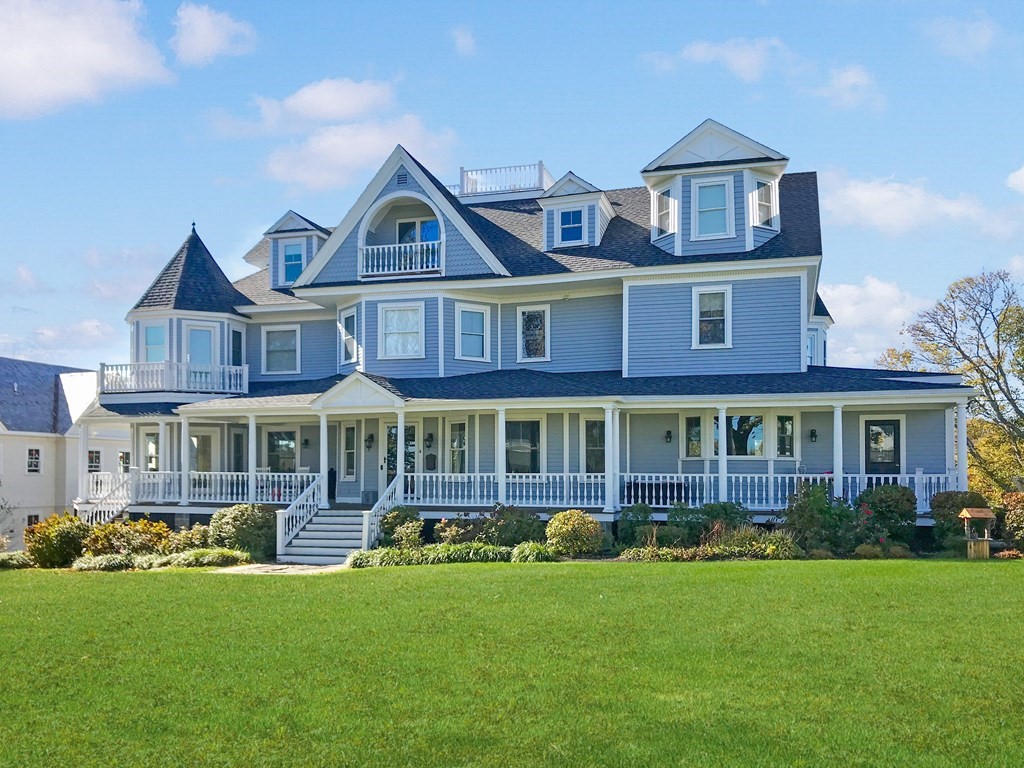 4 Mann Street Hingham, MA 02043 - Photo 1 of 22 a front view of a residential houses with yard and green space