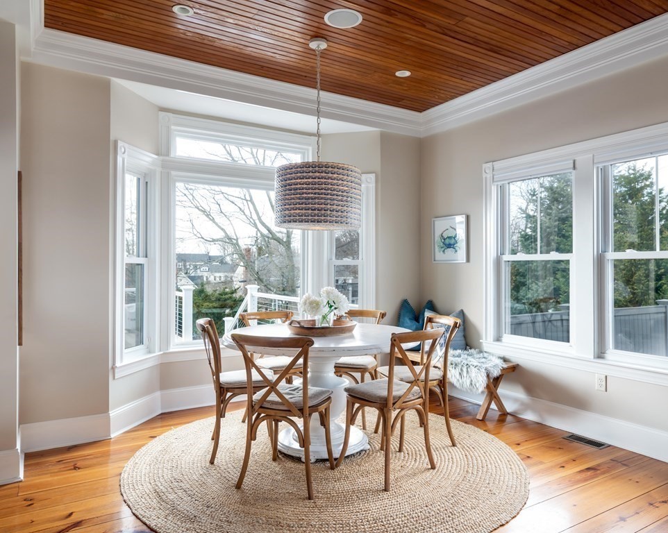 4 Mann Street Hingham, MA 02043 - Photo 11 of 22 a view of a dining room with furniture wooden floor and a rug