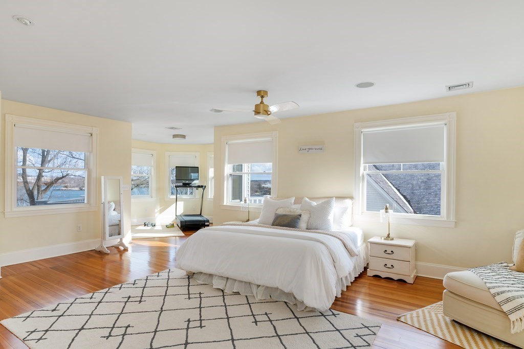 4 Mann Street Hingham, MA 02043 - Photo 13 of 22 a bedroom with a bed and a painting on the wall