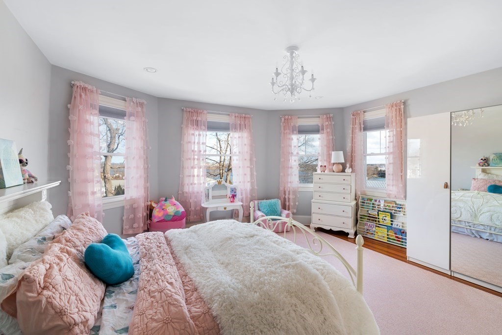 4 Mann Street Hingham, MA 02043 - Photo 14 of 22 a bedroom with a bed and large windows