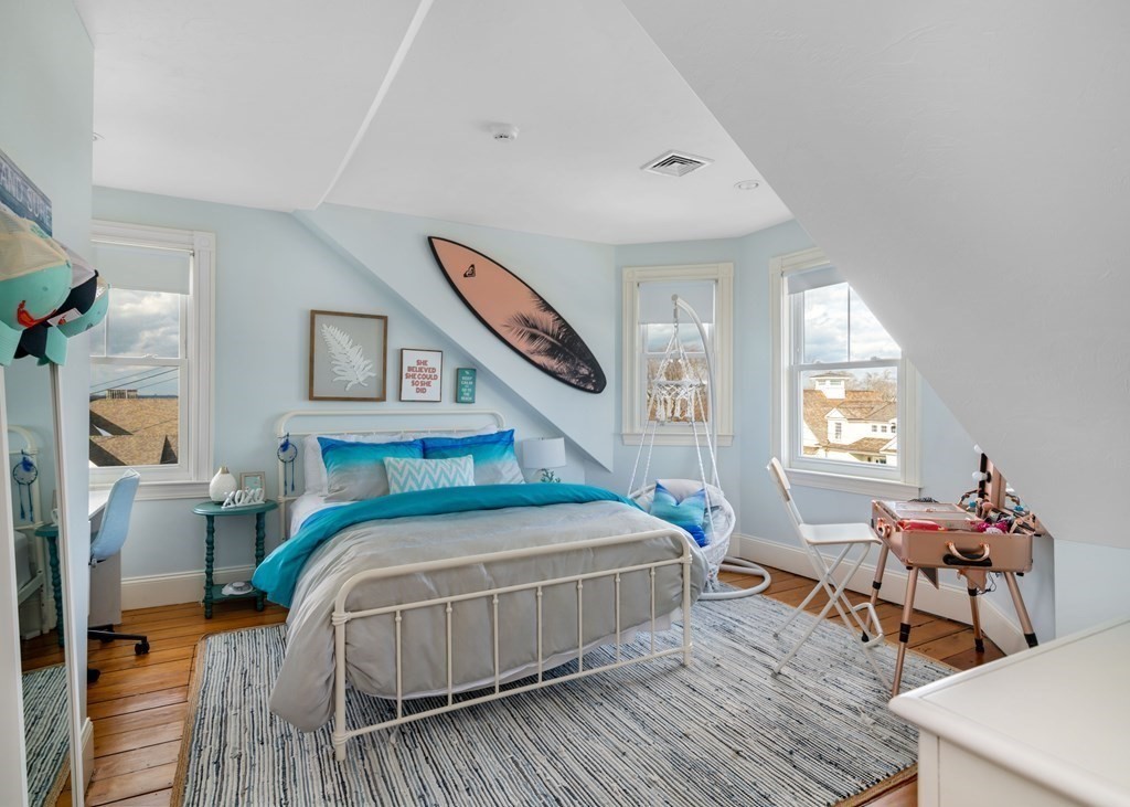 4 Mann Street Hingham, MA 02043 - Photo 15 of 22 a bedroom with a bed and wooden floor