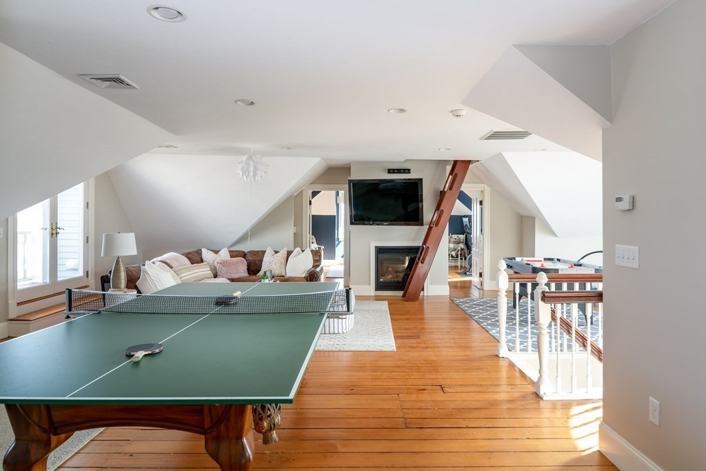 4 Mann Street Hingham, MA 02043 - Photo 18 of 22 a living room with furniture and a wooden floor