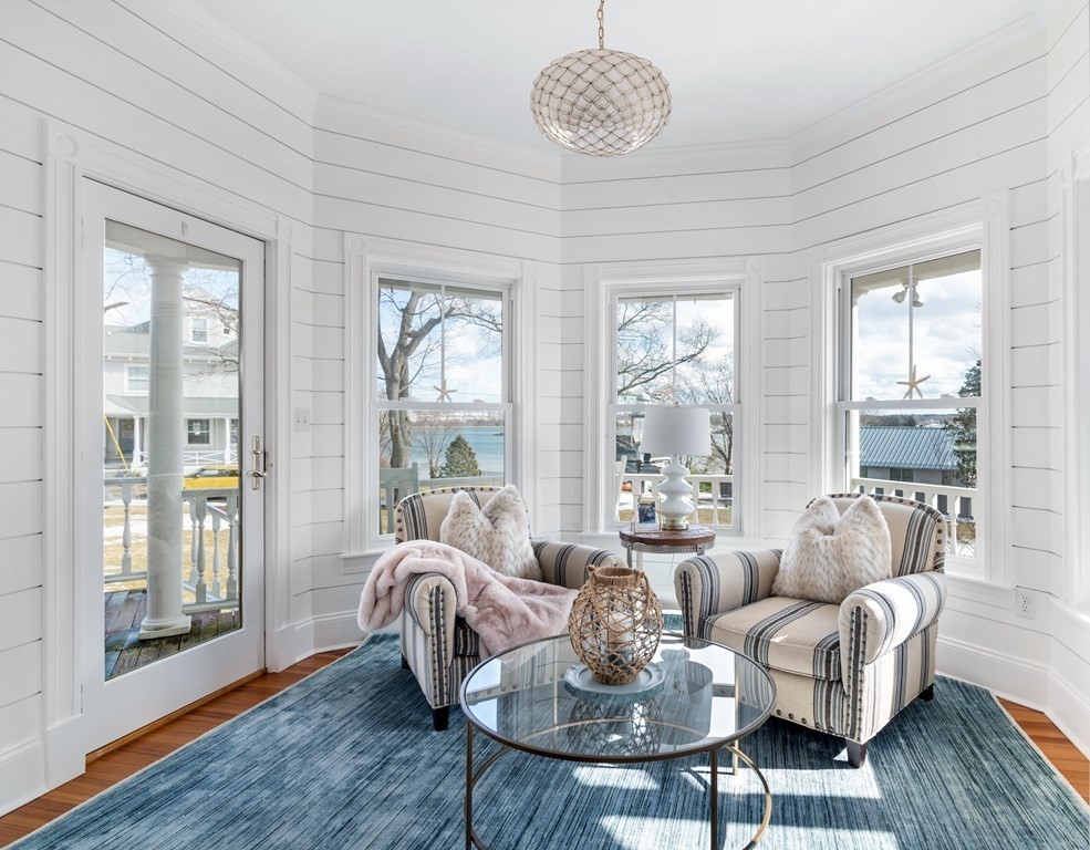 4 Mann Street Hingham, MA 02043 - Photo 4 of 22 a living room with furniture chandelier and a large window